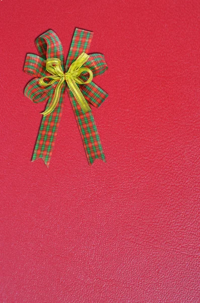 Gift bow on red background — Stock Photo, Image