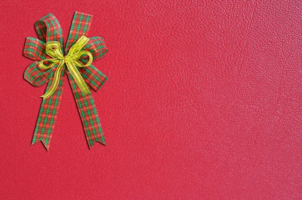 Gift bow on red background — Stock Photo, Image