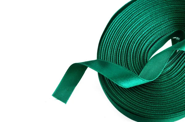 Green ribbon roll on a white background — Stock Photo, Image