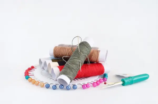 Sewing accessories with pins, needle and thread — Stock Photo, Image