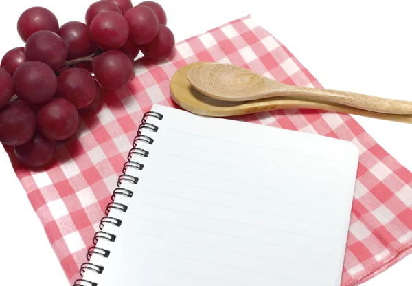 Notebook and spoon — Stock Photo, Image
