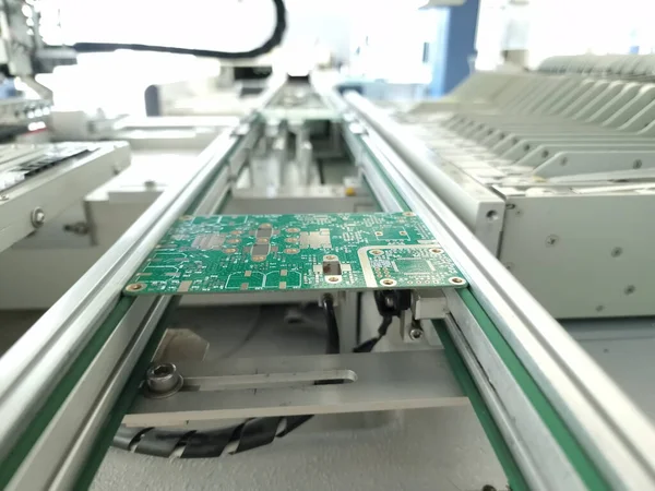 Radio Frequency RF Printed Circuit Board PCB assembling in pick and place machine in small electronics factory