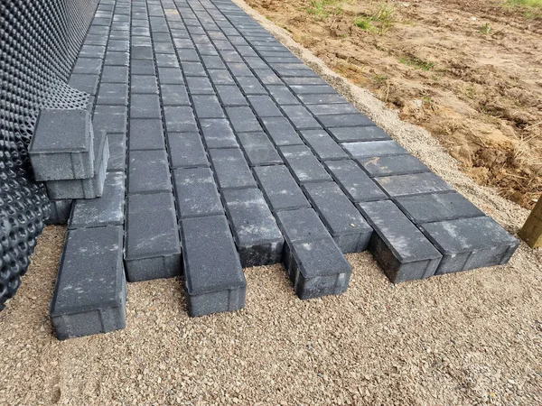 Dark concrete paving under construction in individual house