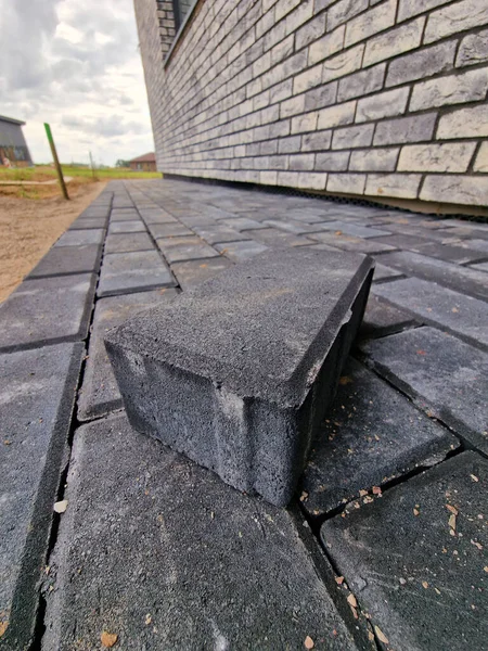 Dark concrete paving under construction in individual house