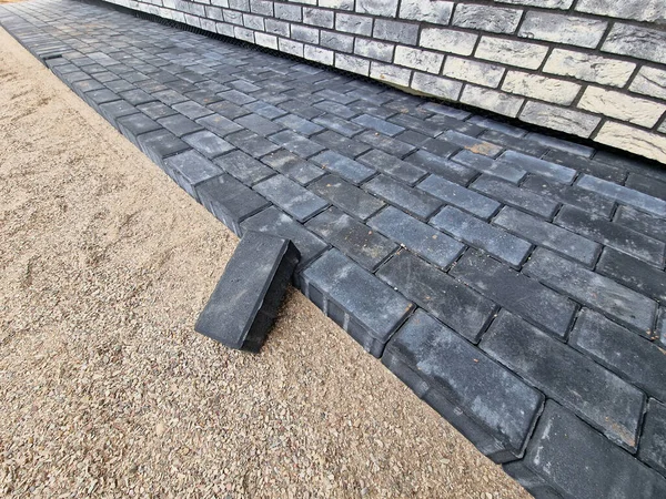 Dark concrete paving under construction in individual house