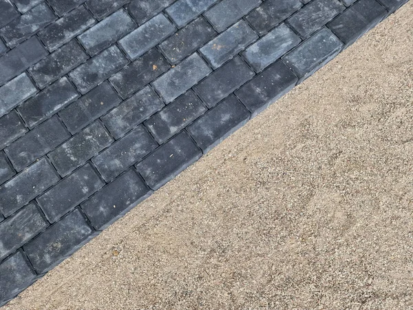 Dark concrete paving under construction in individual house