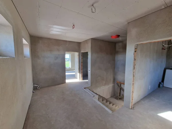 Drywall plaster sheets fixed on ceilings on the construction site