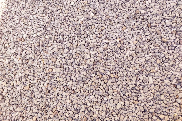 砂利道だ ビー玉の背景 砕いた石の質感 砂利の岩の近くの地面 — ストック写真