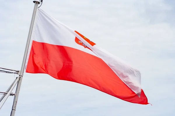 Polish flag in city. Patriotism concept. Flag on wind. Demonstration in Warsaw concept