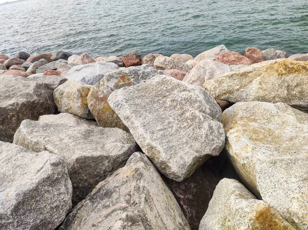 Large stones on the seashore. Stone close up