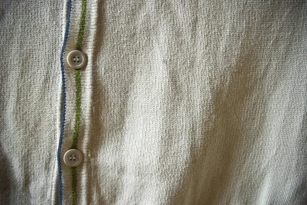 Mavi ve yeşil çizgiler arka plan veya doku ile beyaz veya bej hırka kazak — Stok fotoğraf