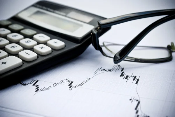 Chart, calculator, glasses as financial stock analysis concept — Stock Photo, Image