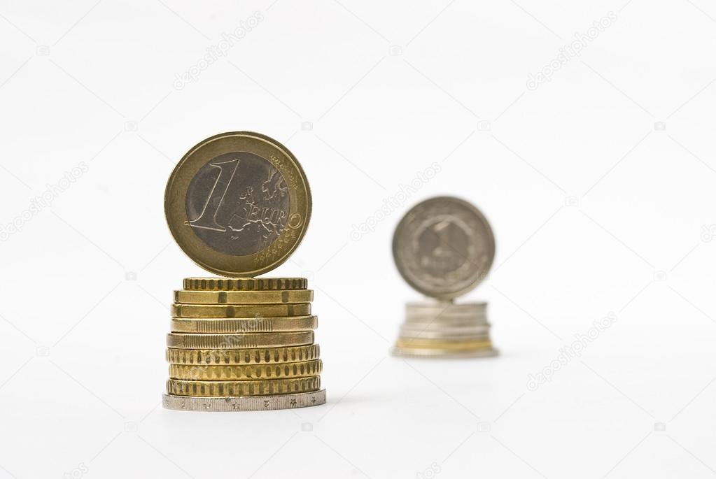 Stack of money euro and zloty coins. Currency rate comparison