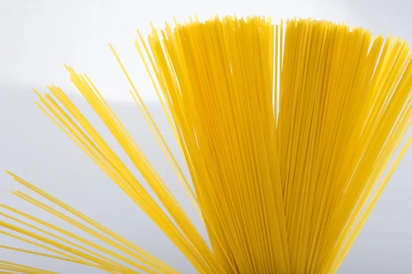 Closeup of uncooked spaghetti noodles — Stock Photo, Image