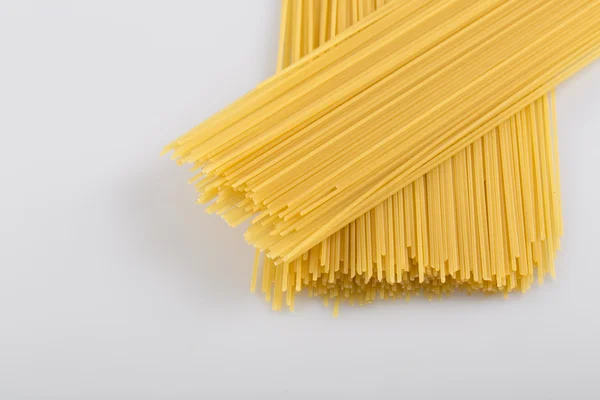 Closeup of uncooked spaghetti noodles — Stock Photo, Image