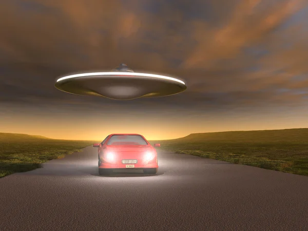 UFO flying over a car — Stock Photo, Image