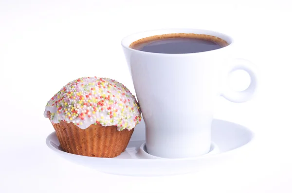 Kaffe med en cupcake med strössel — Stockfoto