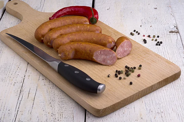 Sausage, peppercorns and chili — Stock Photo, Image