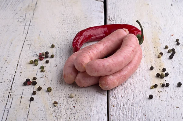 Sausage, peppercorns and chili — Stock Photo, Image