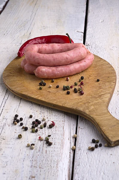 Sausage, peppercorns and chili — Stock Photo, Image