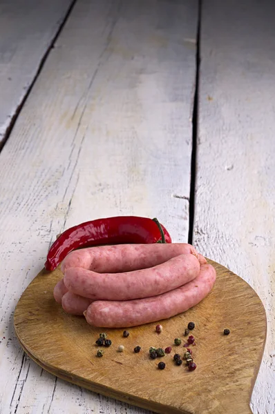 Sausage, peppercorns and chili — Stock Photo, Image