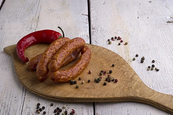 Klobása, pepře a chilli — Stock fotografie