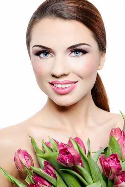 Beautiful woman with tulips — Stock Photo, Image