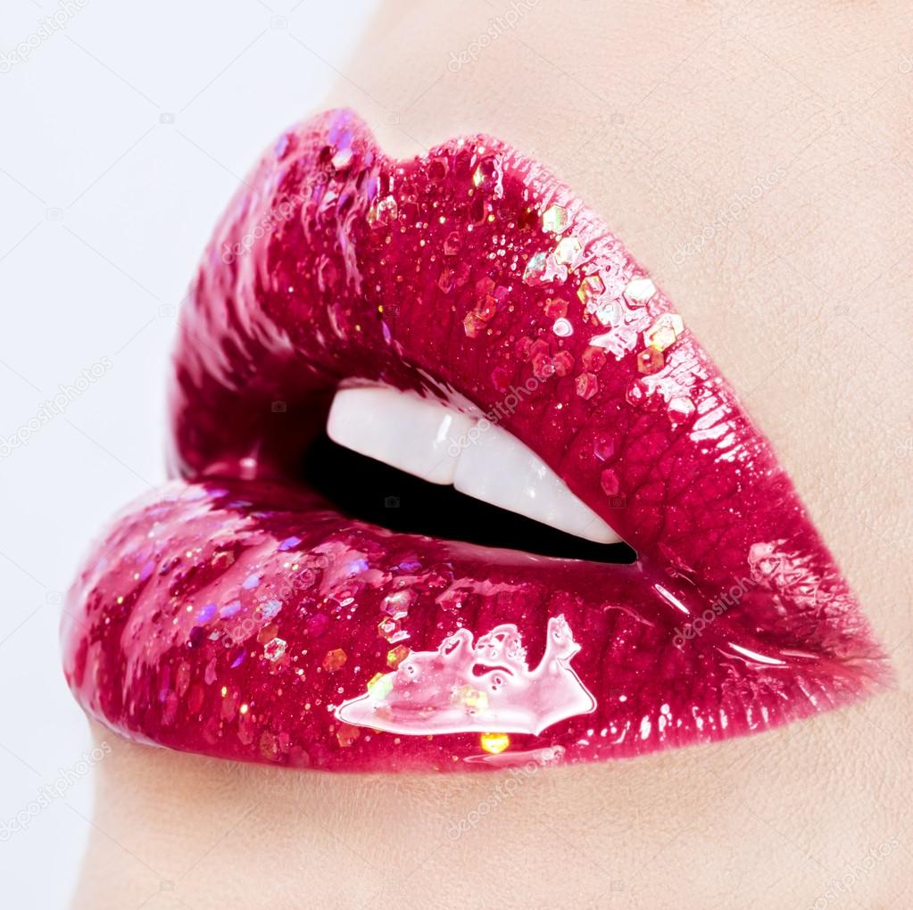 Beautiful glossy female lips close up