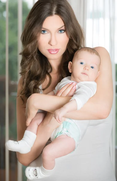 Cute baby with a beautiful mom Stock Photo