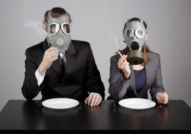 Couple at gas masks burning cigarettes clipart