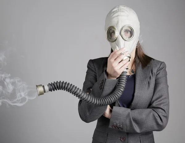 Woman in a gas mask with a cigarette — Stock Photo, Image