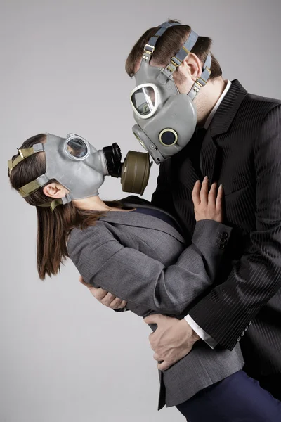 Couple in love in gas masks