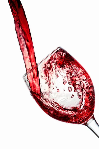 Red wine poured into wine glass — Stock Photo, Image