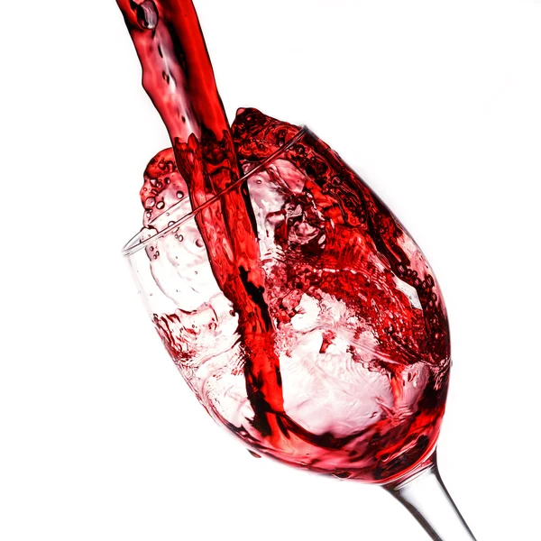 Red wine poured into wine glass — Stock Photo, Image