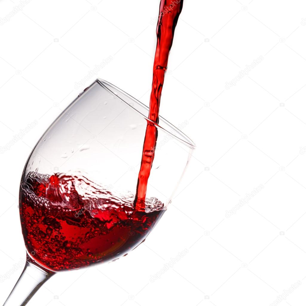 Red wine poured into wine glass