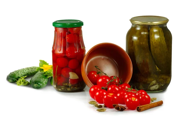 Jars with tomatoes and cucumbers isolate — Stock Photo, Image