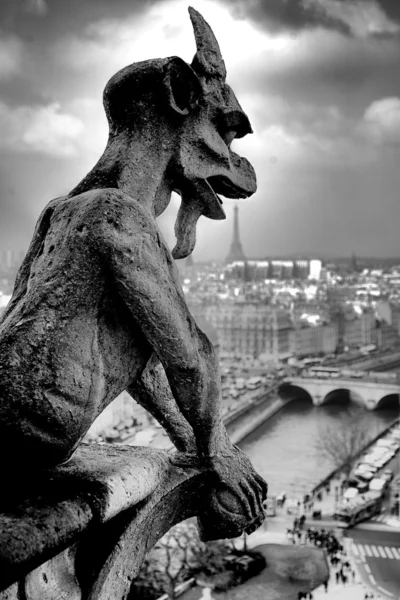 Gargoyle eating Tour Eiffel — Stock Photo, Image