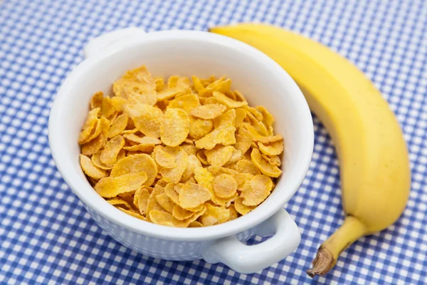 Corn flakes with banana — Stock Photo, Image