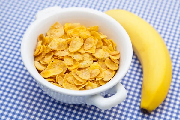 Corn flakes with banana — Stock Photo, Image