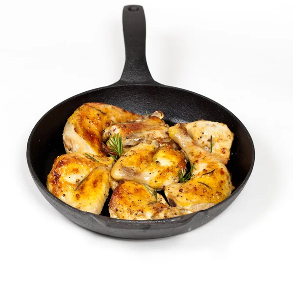 Frying pan with chicken, garlic and rosemary — Stock Photo, Image