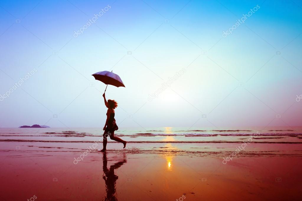 Running woman with umbrella