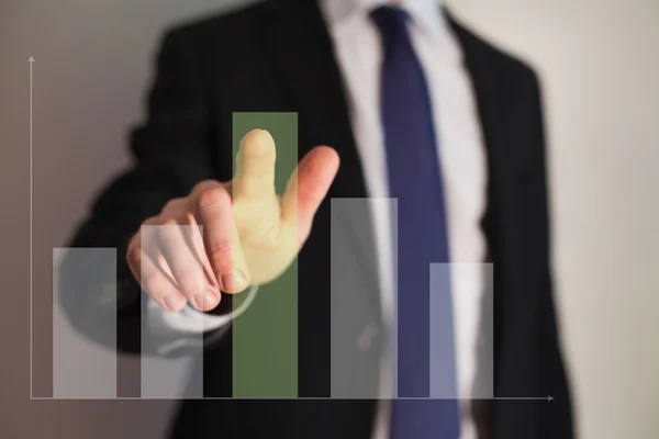 Businessman presenting a successful sustainable development on a bar chart — Stock Photo, Image