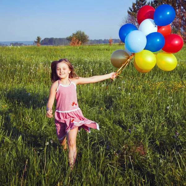 Girl with balloons — Stock Photo, Image