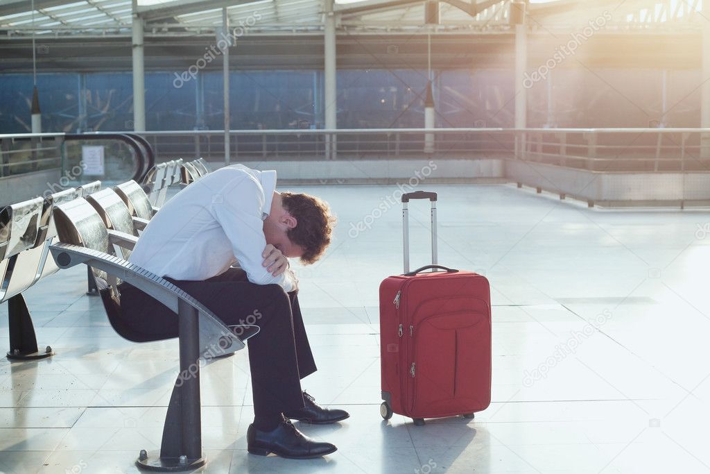 Man waiting for departure of his flight