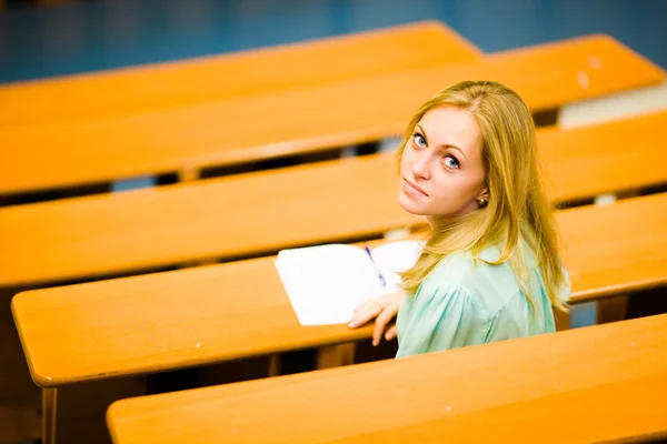 Student girl in auditorium — Stock Photo, Image
