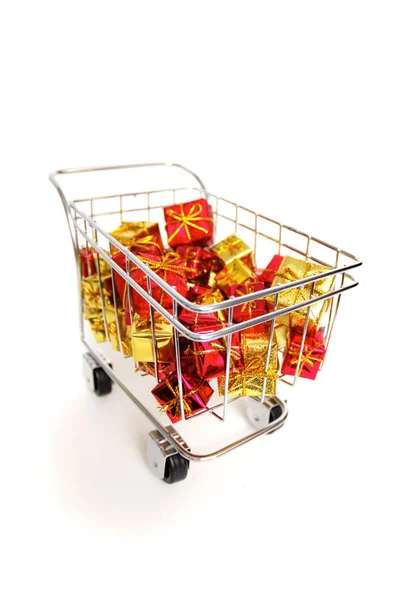 Bunch of gifts in a shopping cart — Stock Photo, Image