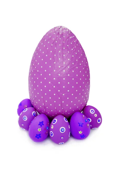 Purple wrapped chocolate Easter Eggs and little ones — Stock Photo, Image