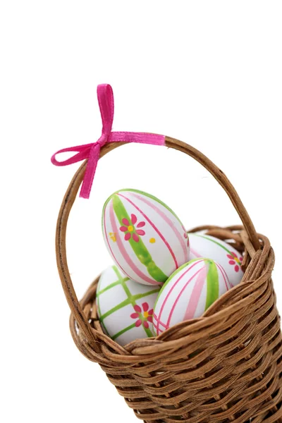 Three Easter eggs in a basket from corner — Stock Photo, Image