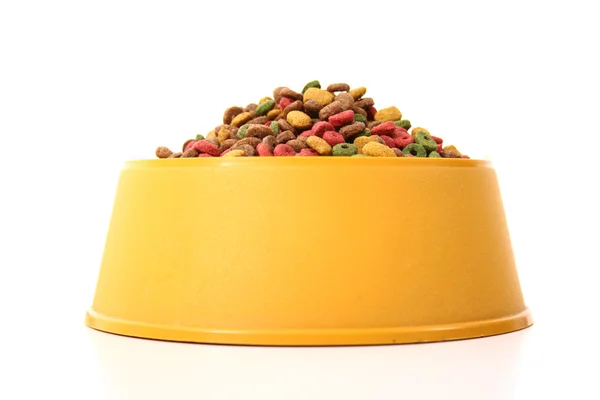 Colored dog food in a bowl — Stock Photo, Image
