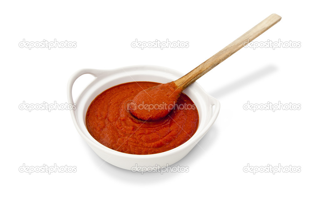 Tomato sauce and wooden spoon — Stock Photo © lucato 35293091